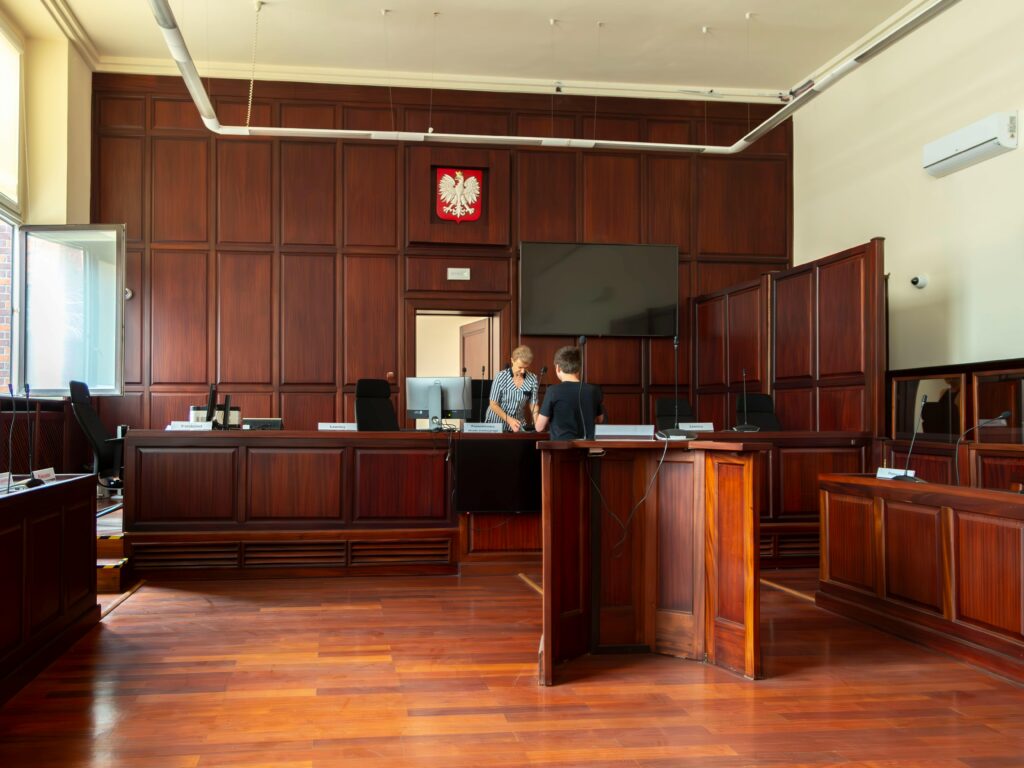 pexels-photo-37726668-37726668 Spacious Polish courtroom with wooden panels and furniture located in Wrocław, Lower Silesia.